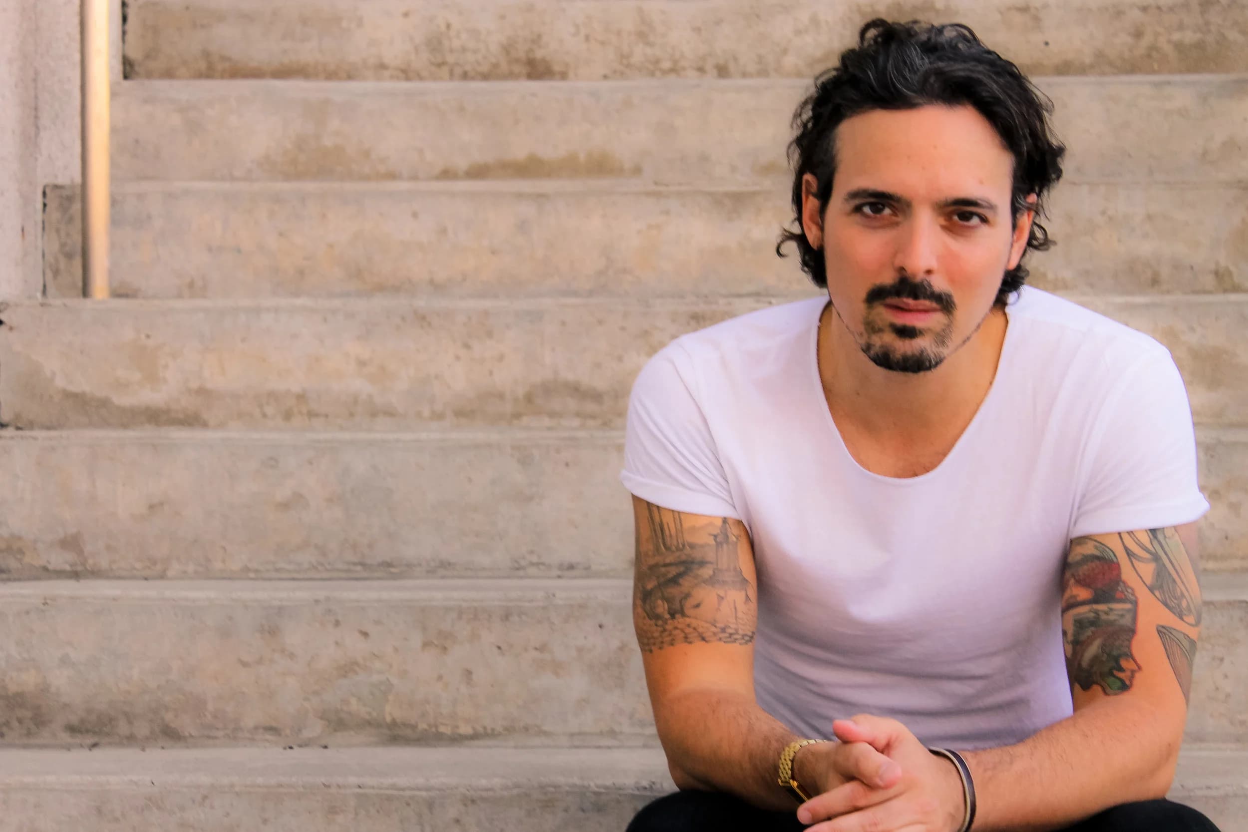 David James Brock seated on concrete steps
